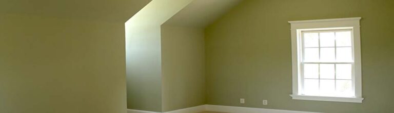 Empty upstairs bedroom with a fresh coat of green paint